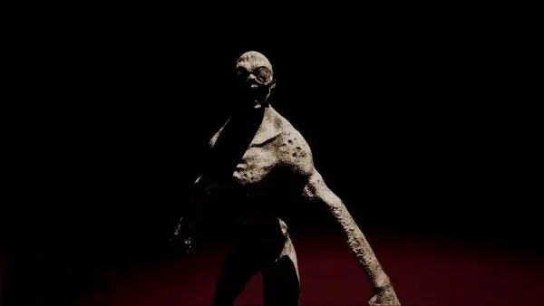 The creature lunges out of the dark