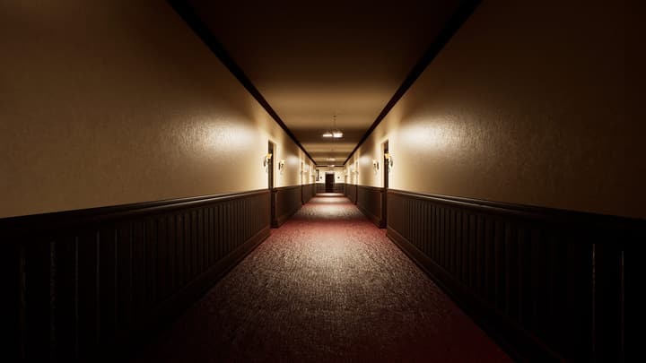 Corridor lit by wall lamps